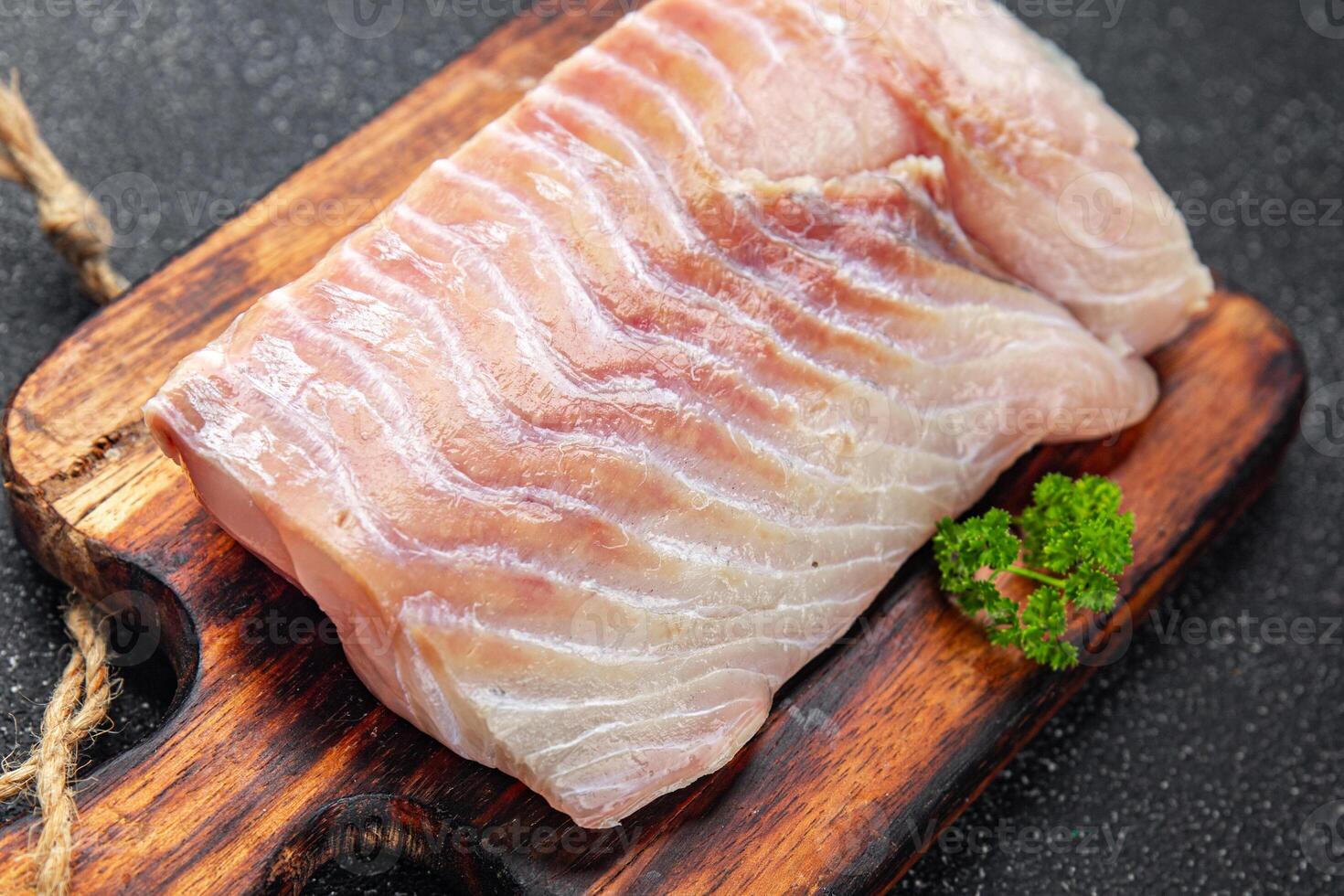 raw fish fillet seafood ready to cook natural fresh appetizer meal food snack on the table copy space food background rustic top view keto or paleo diet vegetarian food Pescetarian photo
