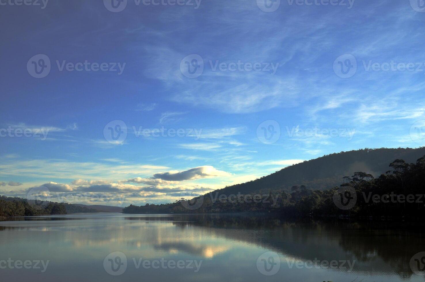 Peaceful reflection of Cradle Mountain in the lake in Tasmania Australia photo