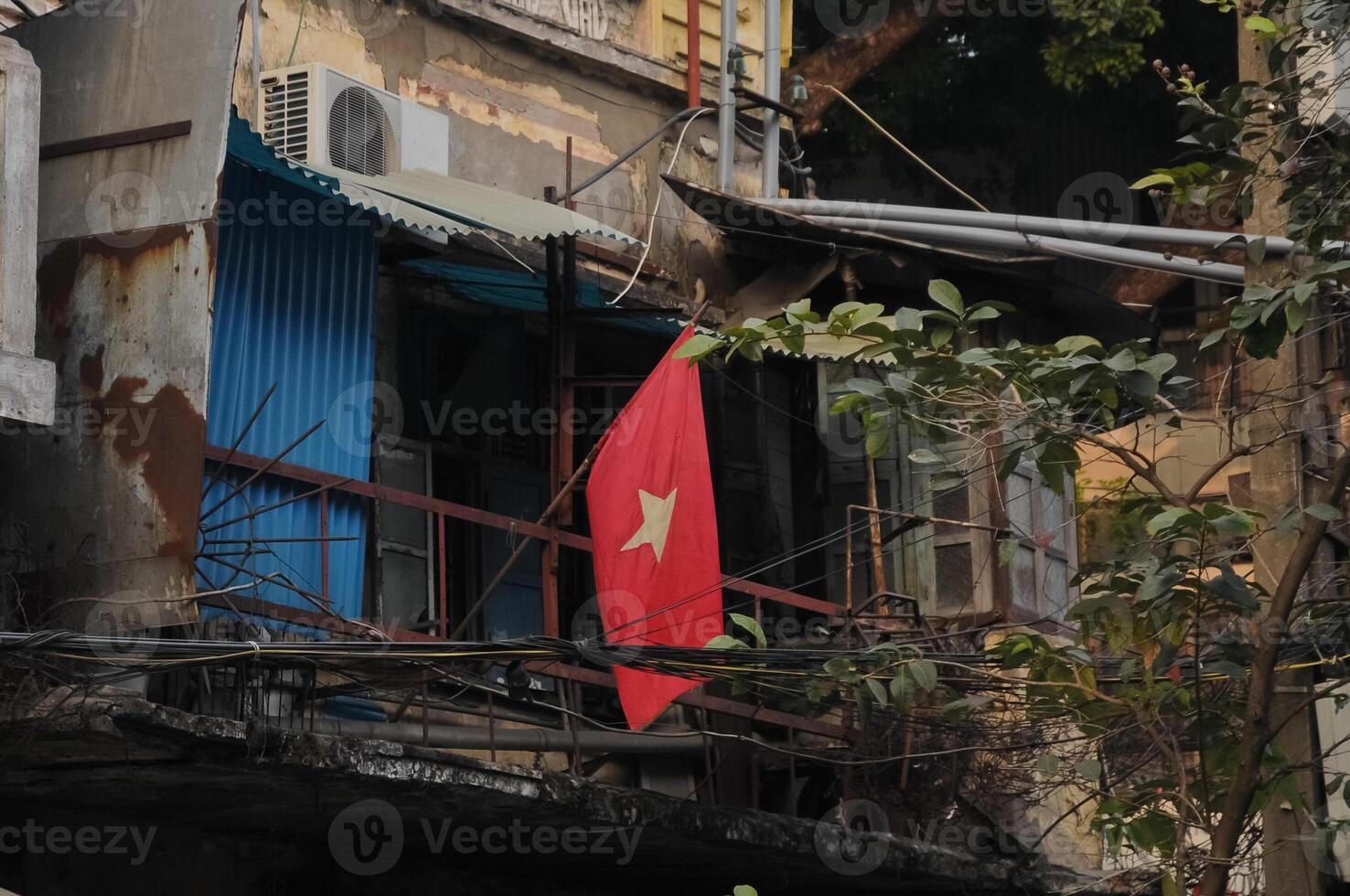 Vietnam national flag and old poor townhouse photo