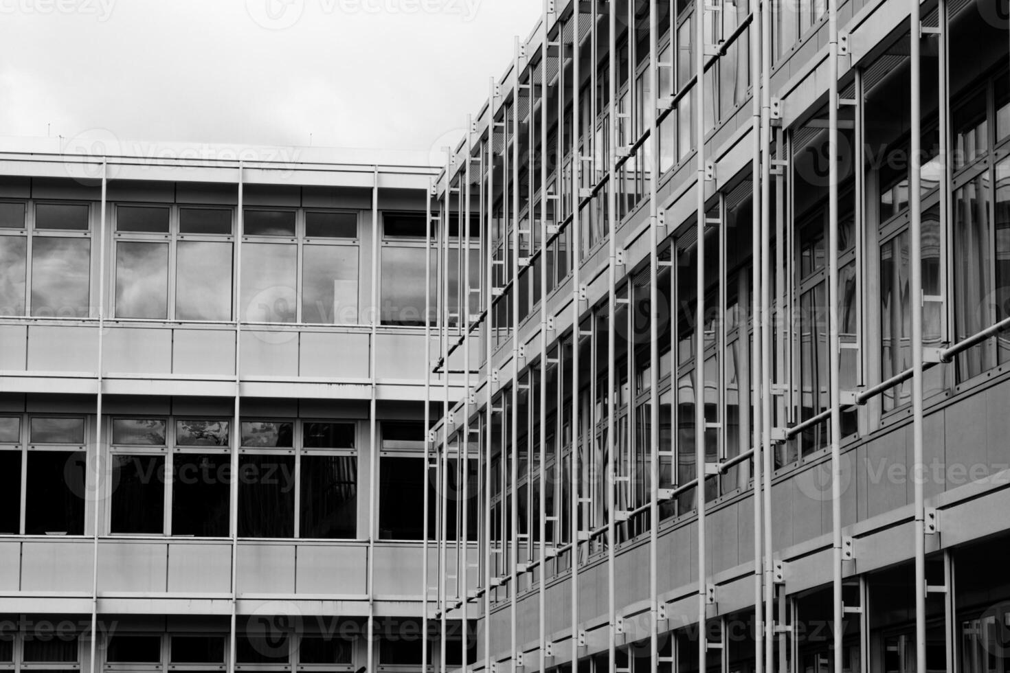 facade of a modern office building, greyscale shot photo