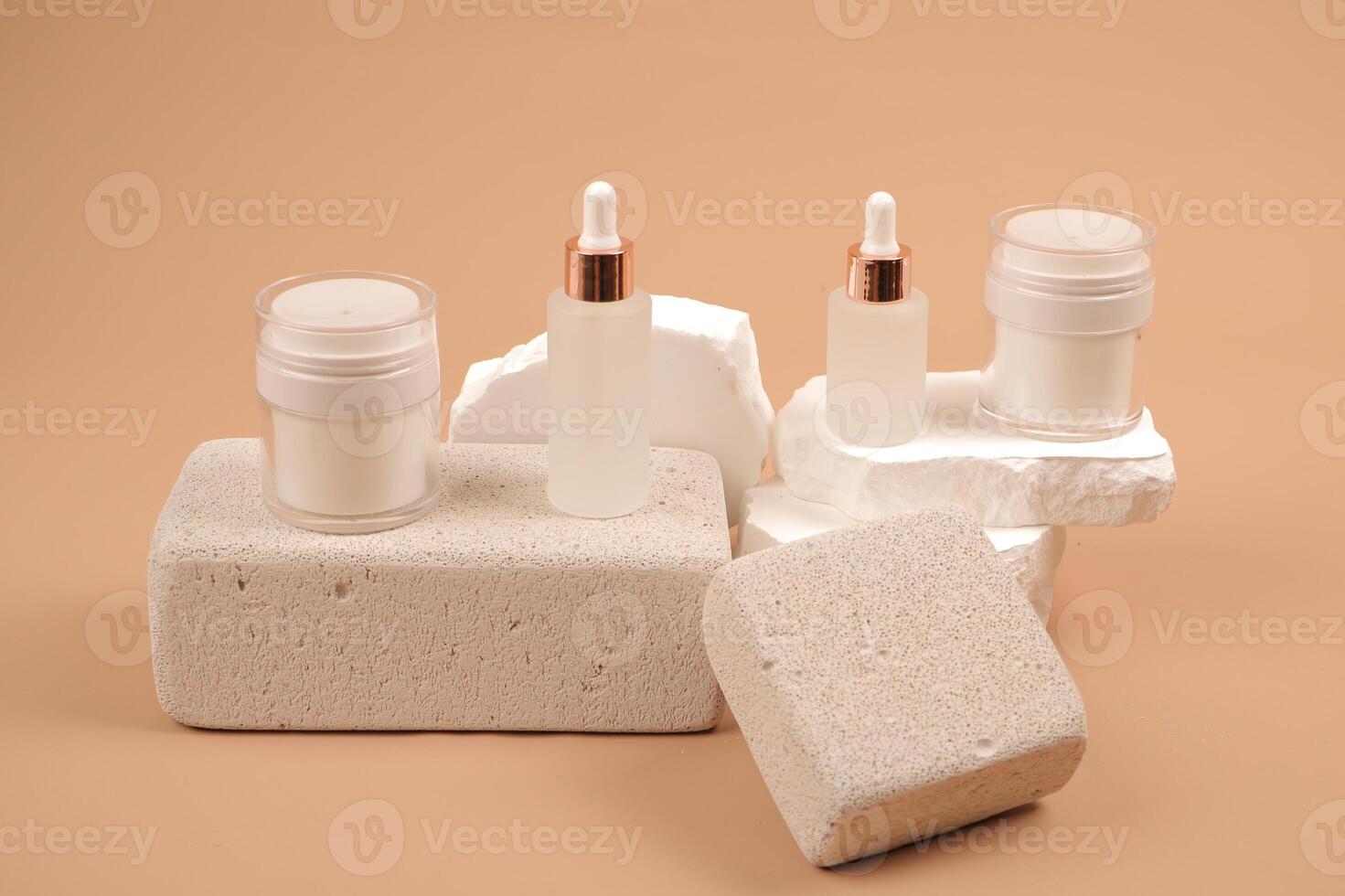 Minimalist Skincare Product Arrangement on Textured Stones photo