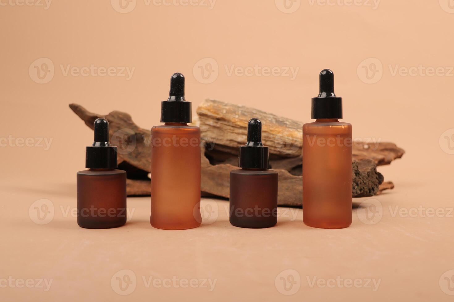 Elegant Frosted Dropper Bottles for Organic Skincare on Earthy Background photo