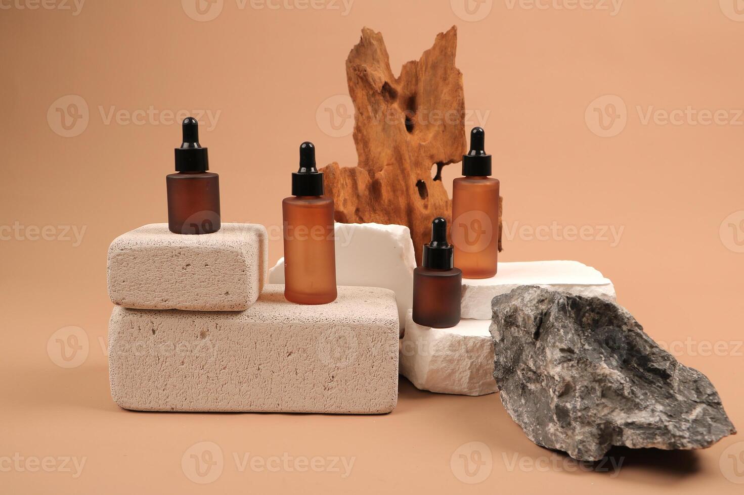 Natural Skincare Serum Bottles on Textured Stones Display photo
