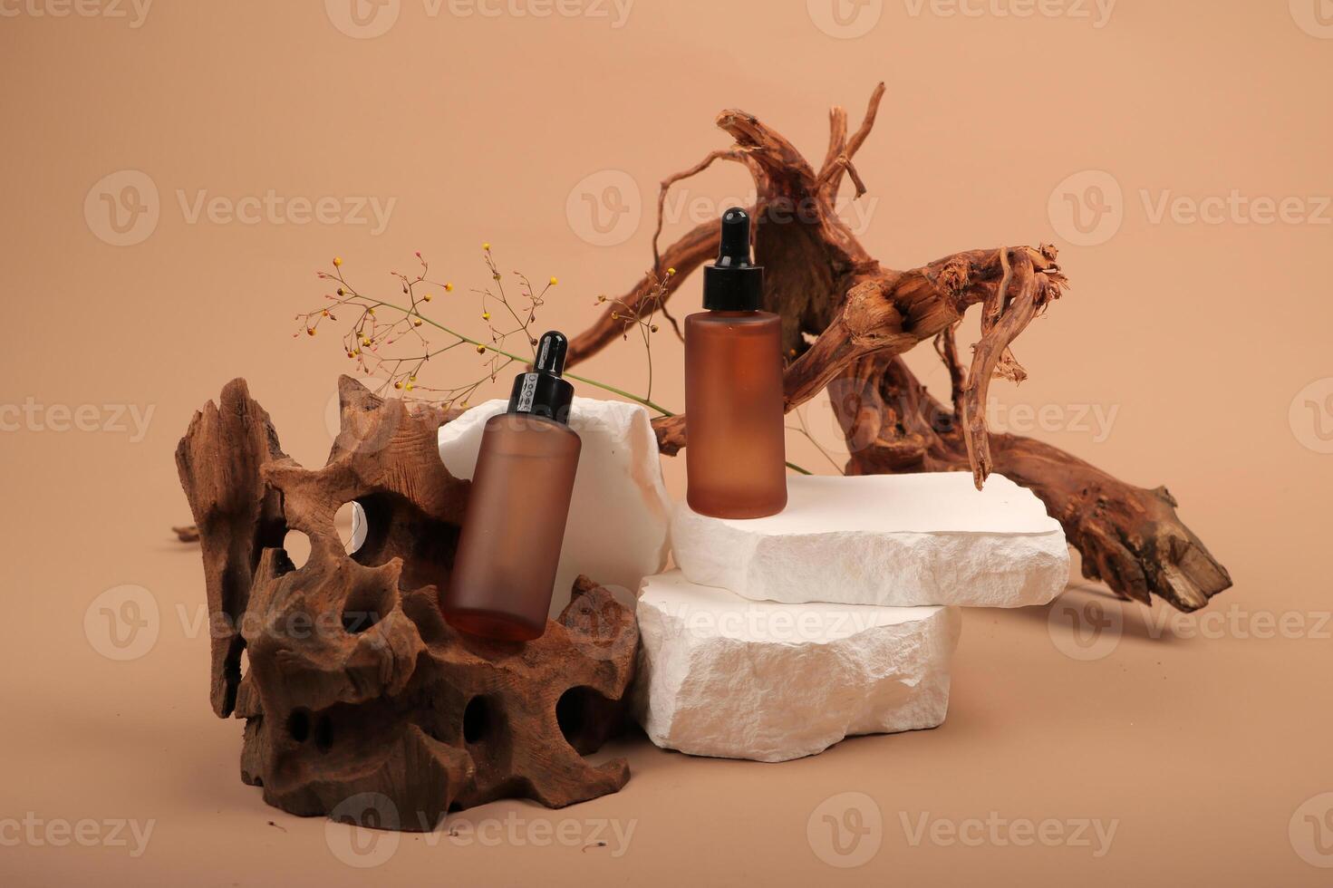 Amber Glass Dropper Bottles on White Stone and Wood Display photo