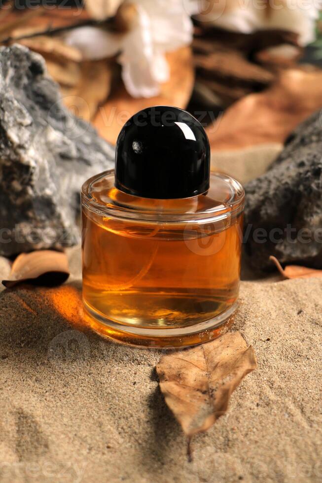 Premium Amber Glass Bottle on Sandy Background photo