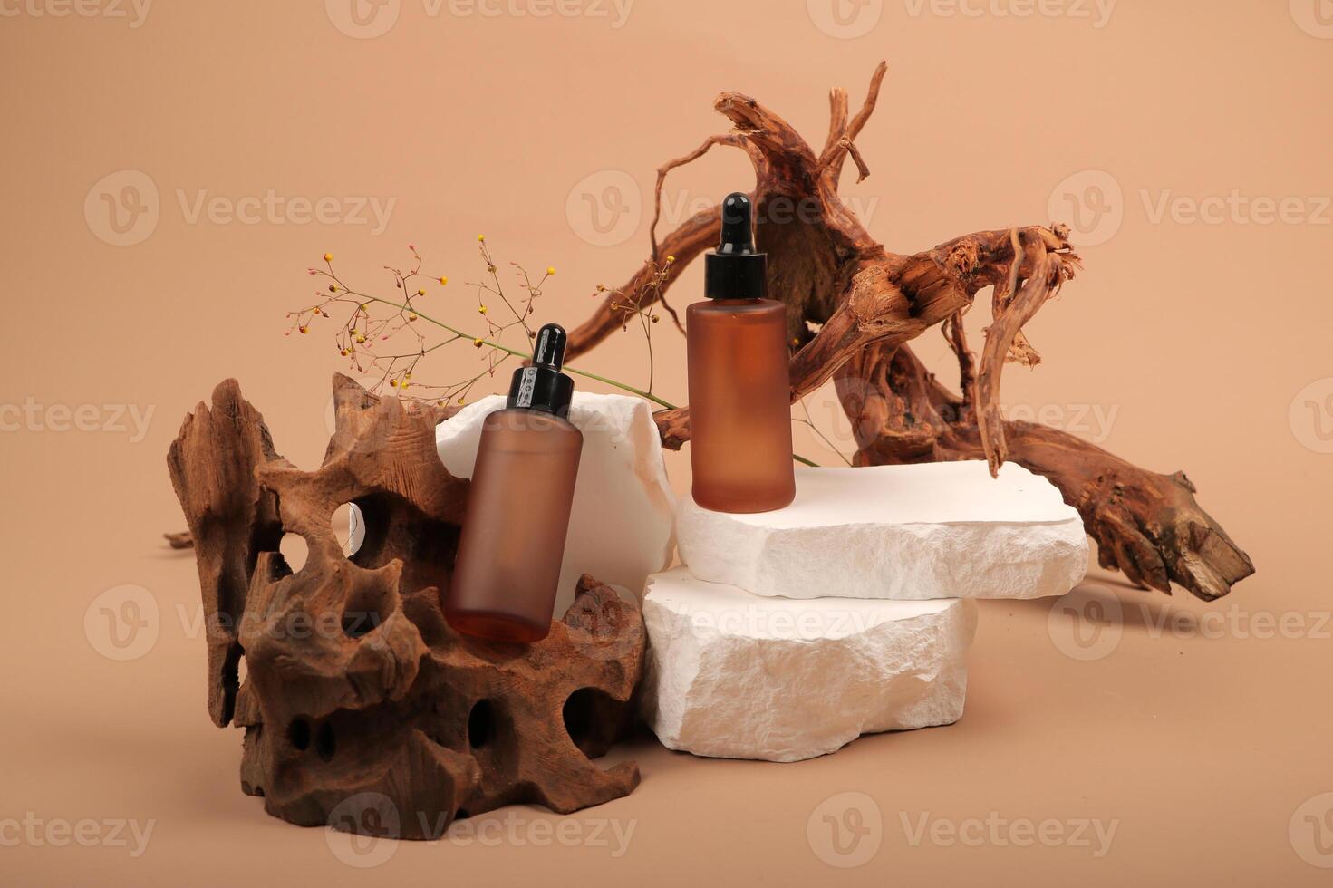 Amber Glass Dropper Bottles on White Stone and Wood Display photo