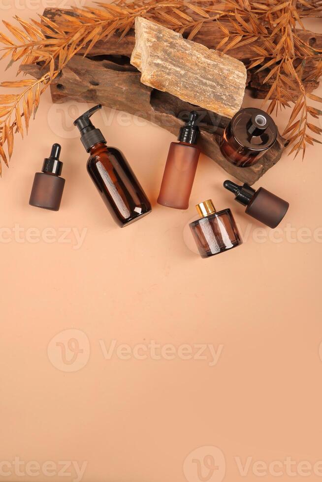 Organic Skincare Bottles with Dropper and Pump on Natural Background photo