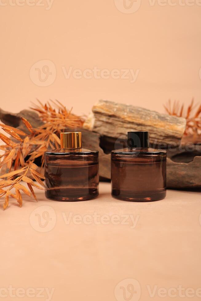 Elegant Amber Glass Bottles with Wooden Background for Natural Skincare photo