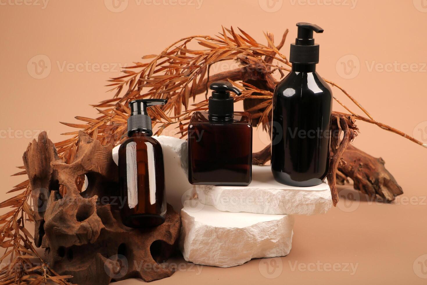 Elegant Black and Amber Pump Bottles on Natural Rustic Display photo