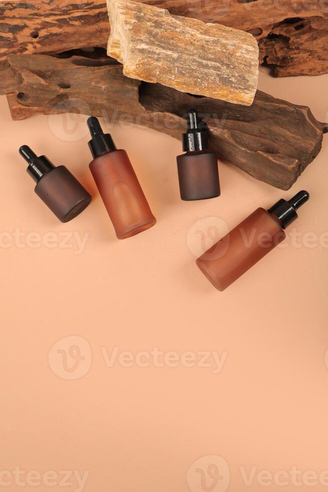 Stylish Frosted Dropper Bottles for Skincare Products on Natural Background photo