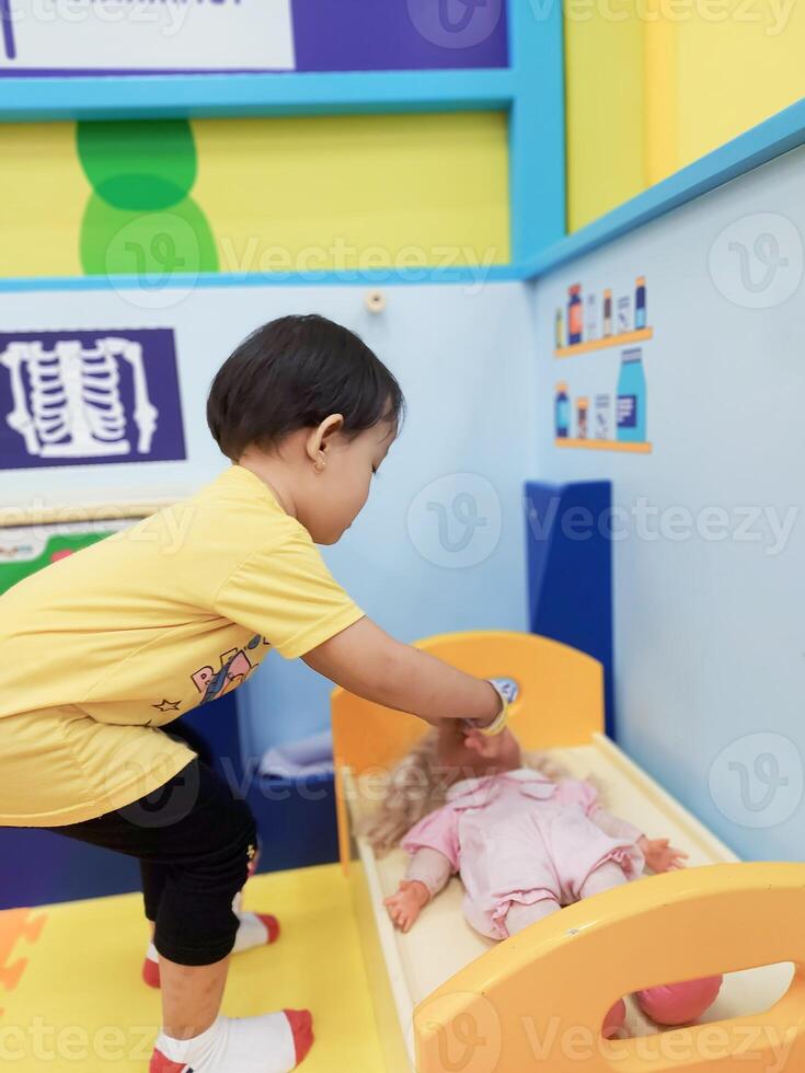 Positive activities for children playing in an indoor area filled with toy facilities and a place where they can find unlimited creativity photo