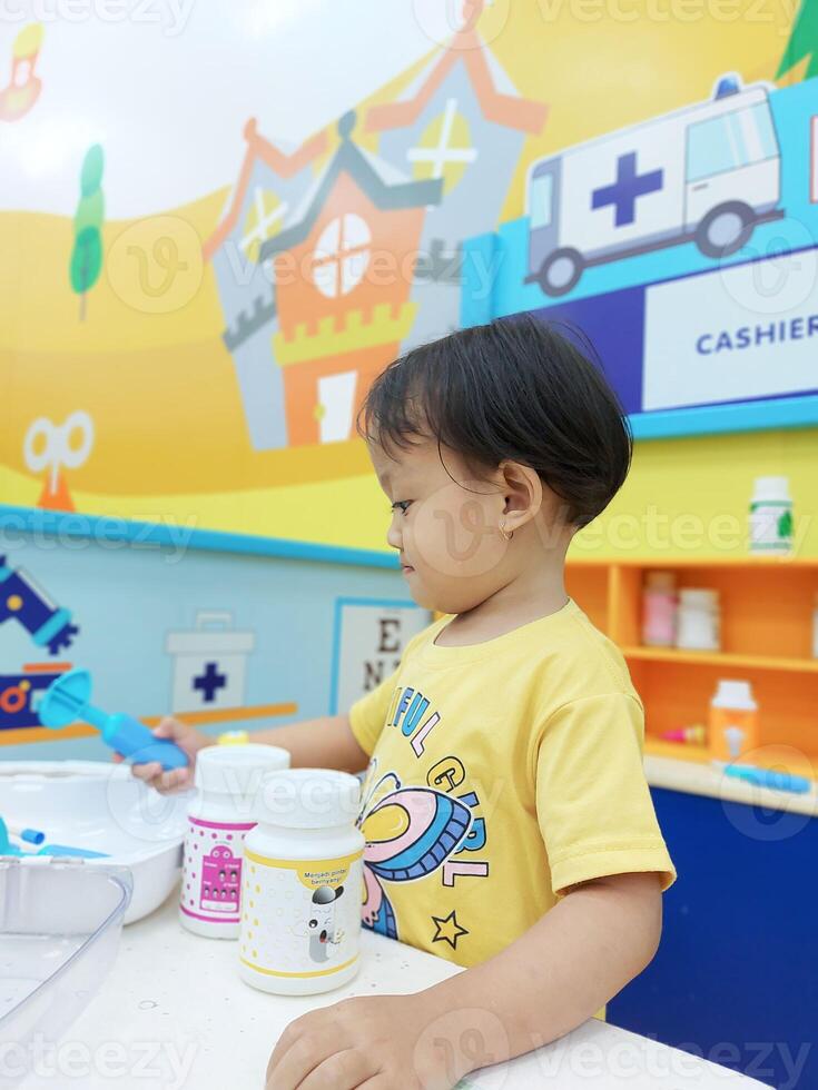 Positive activities for children playing in an indoor area filled with toy facilities and a place where they can find unlimited creativity photo