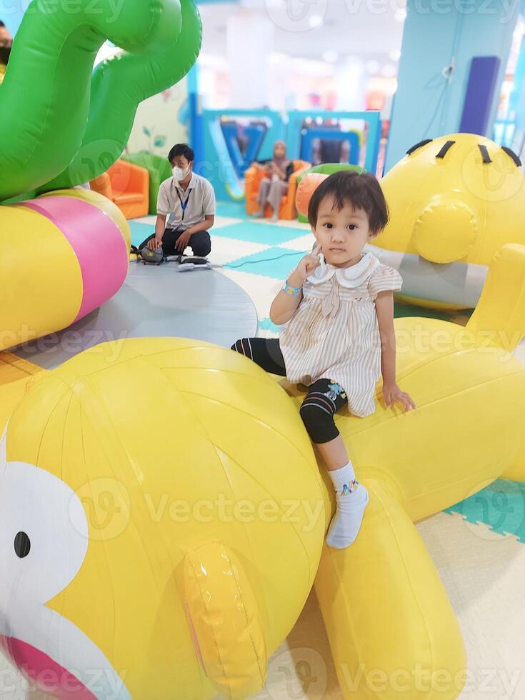 Positive activities for children playing in an indoor area filled with toy facilities and a place where they can find unlimited creativity photo