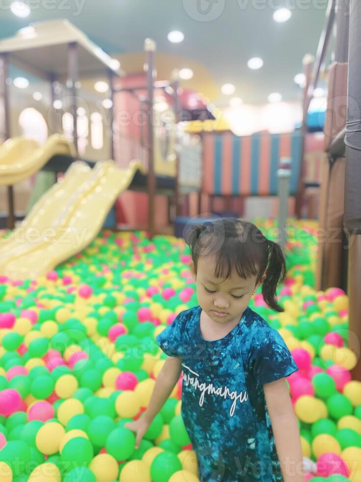 Positive activities for children playing in an indoor area filled with toy facilities and a place where they can find unlimited creativity photo