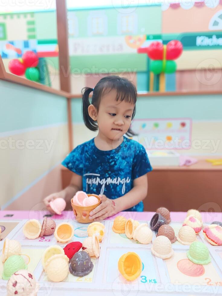 Positive activities for children playing in an indoor area filled with toy facilities and a place where they can find unlimited creativity photo
