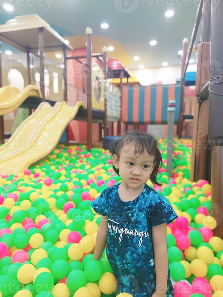 Positive activities for children playing in an indoor area filled with toy facilities and a place where they can find unlimited creativity photo