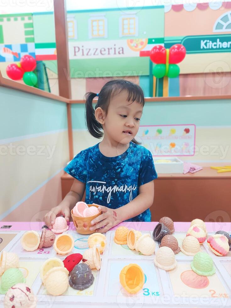 Positive activities for children playing in an indoor area filled with toy facilities and a place where they can find unlimited creativity photo