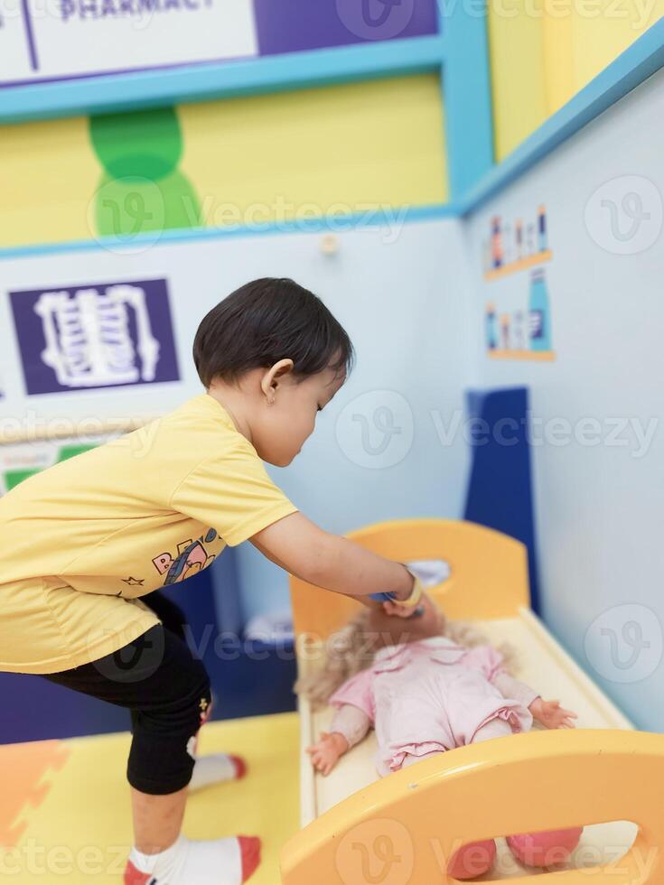 Positive activities for children playing in an indoor area filled with toy facilities and a place where they can find unlimited creativity photo