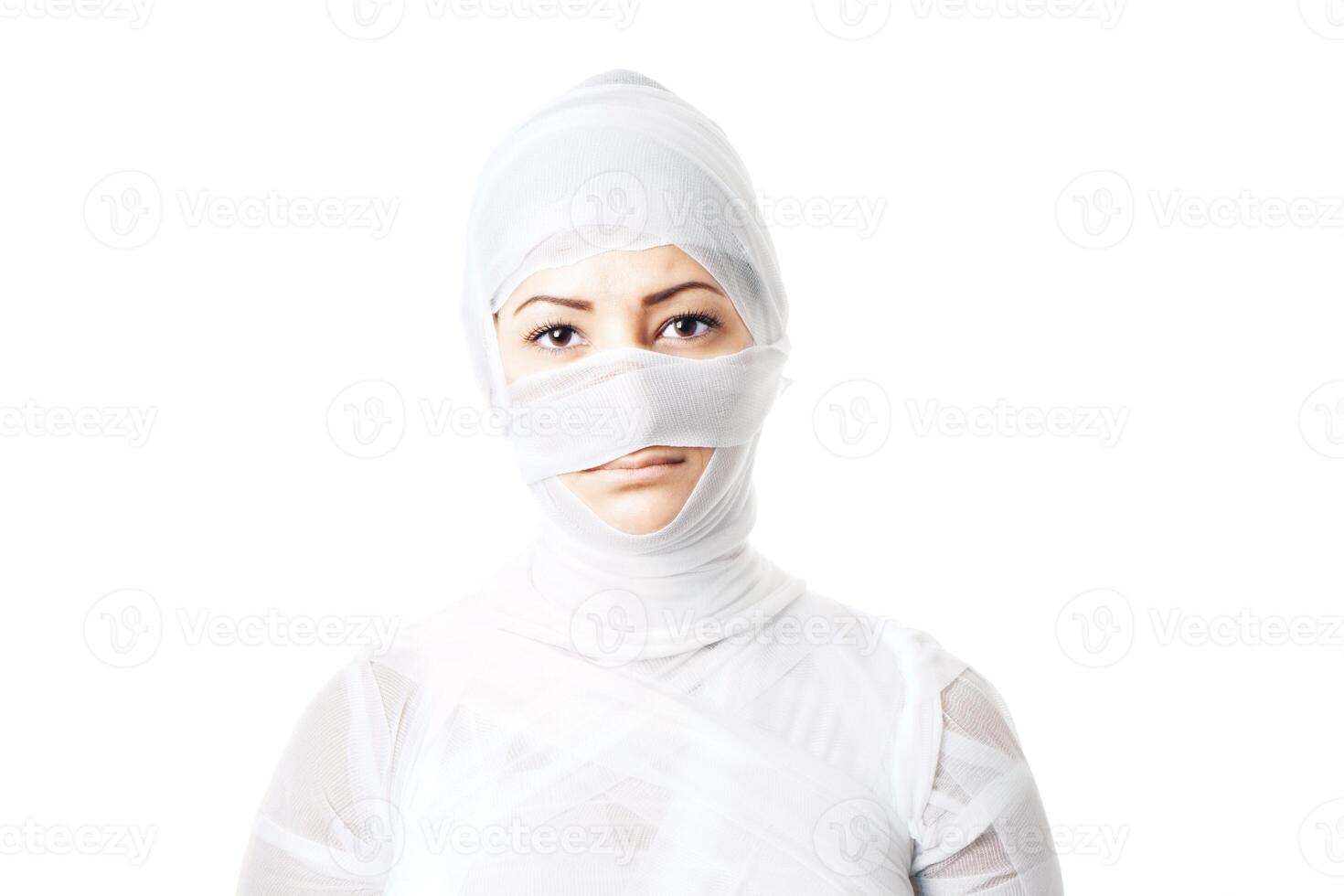 female patient wrapped in bandages photo
