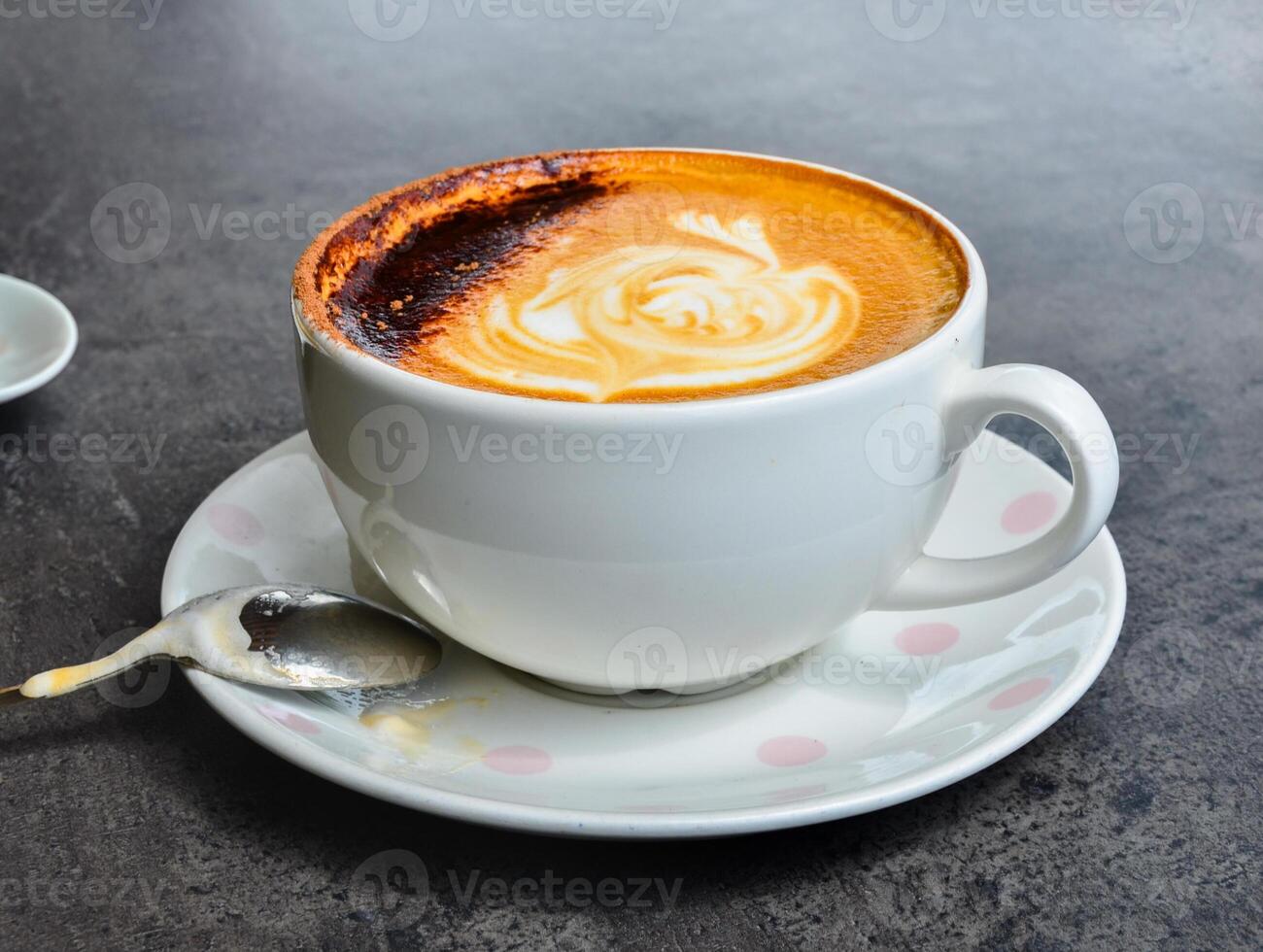 a cup of the most aromatic, delicious cappuccino with lush chocolate foam photo