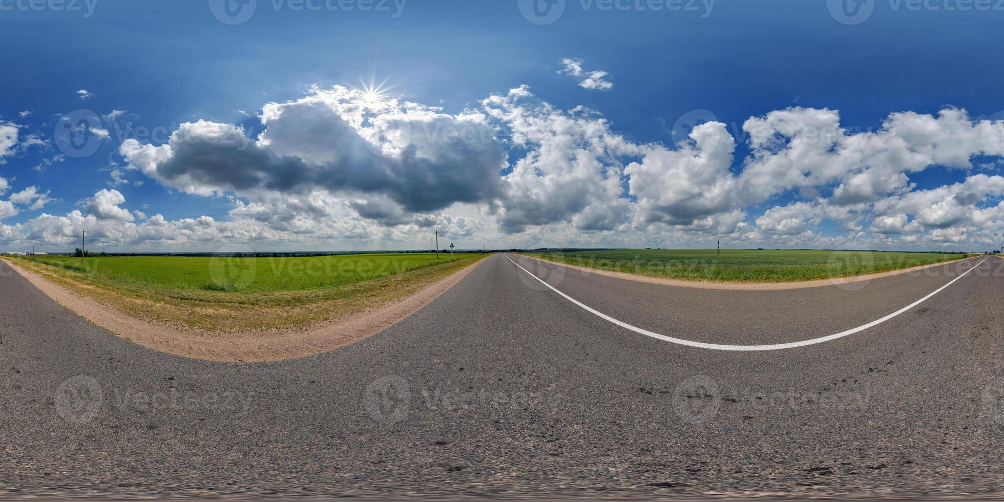 spherical 360 hdri panorama on old asphalt road with clouds and sun on blue sky in equirectangular seamless projection, as skydome replacement in drone panoramas, game development photo