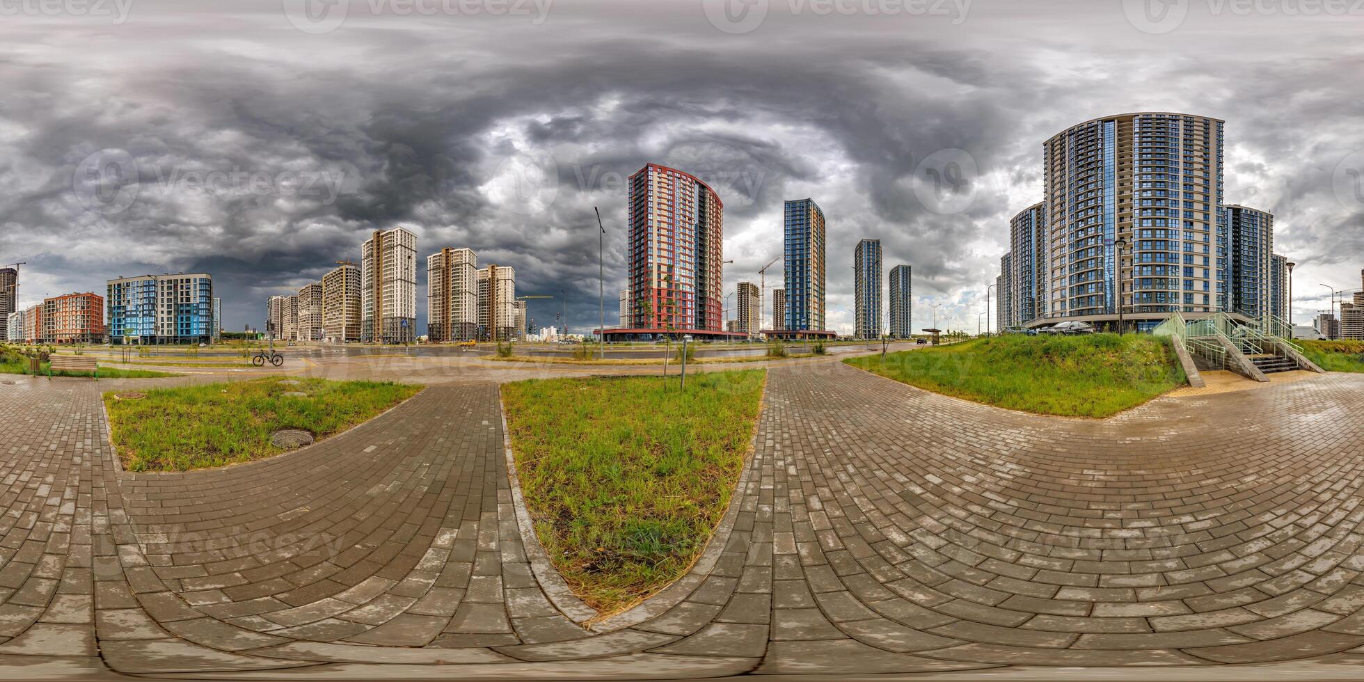 hdri 360 panorama on pedestrian road in elite residential complex with skyscrapers before rain or after storm with black sky and dark clouds in full equirectangular seamless spherical projection photo