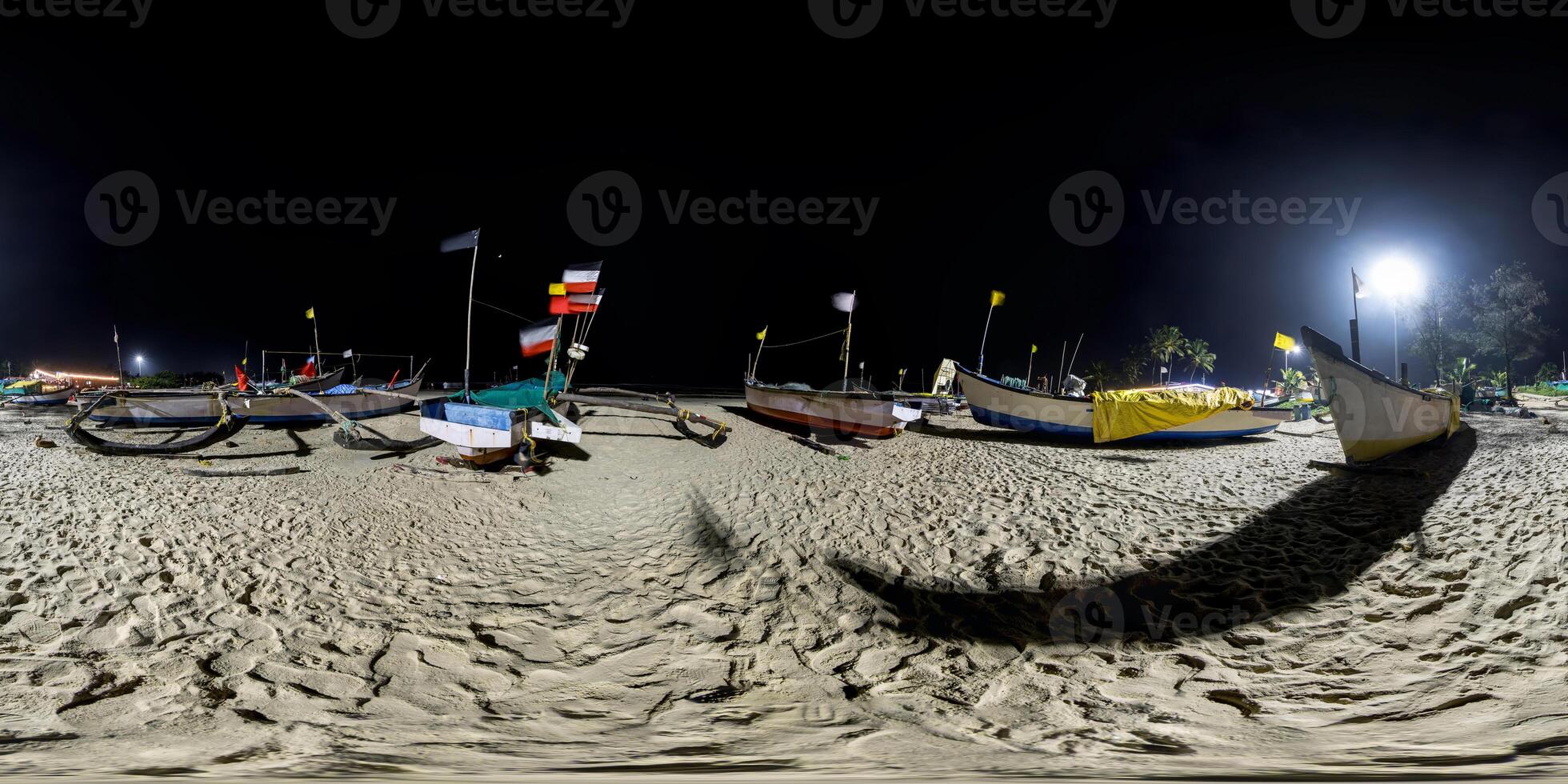 360 night panorama near old fishing boats in the sand on the ocean in equirectangular spherical seamless projection photo