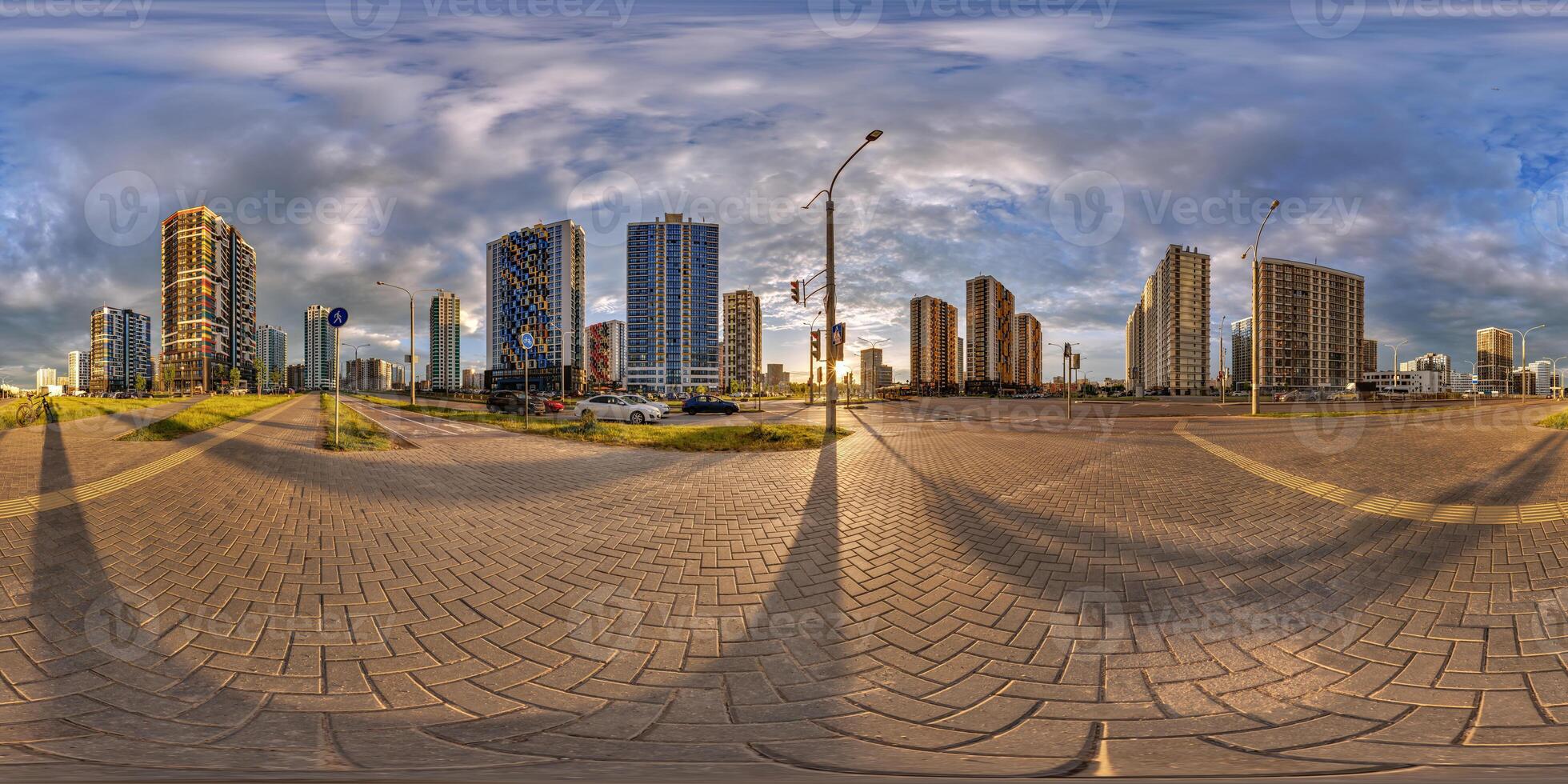 hdri 360 panorama on pedestrian road near new skyscrapers and residential complex after rain and storm before sunset in full equirectangular seamless spherical projection photo