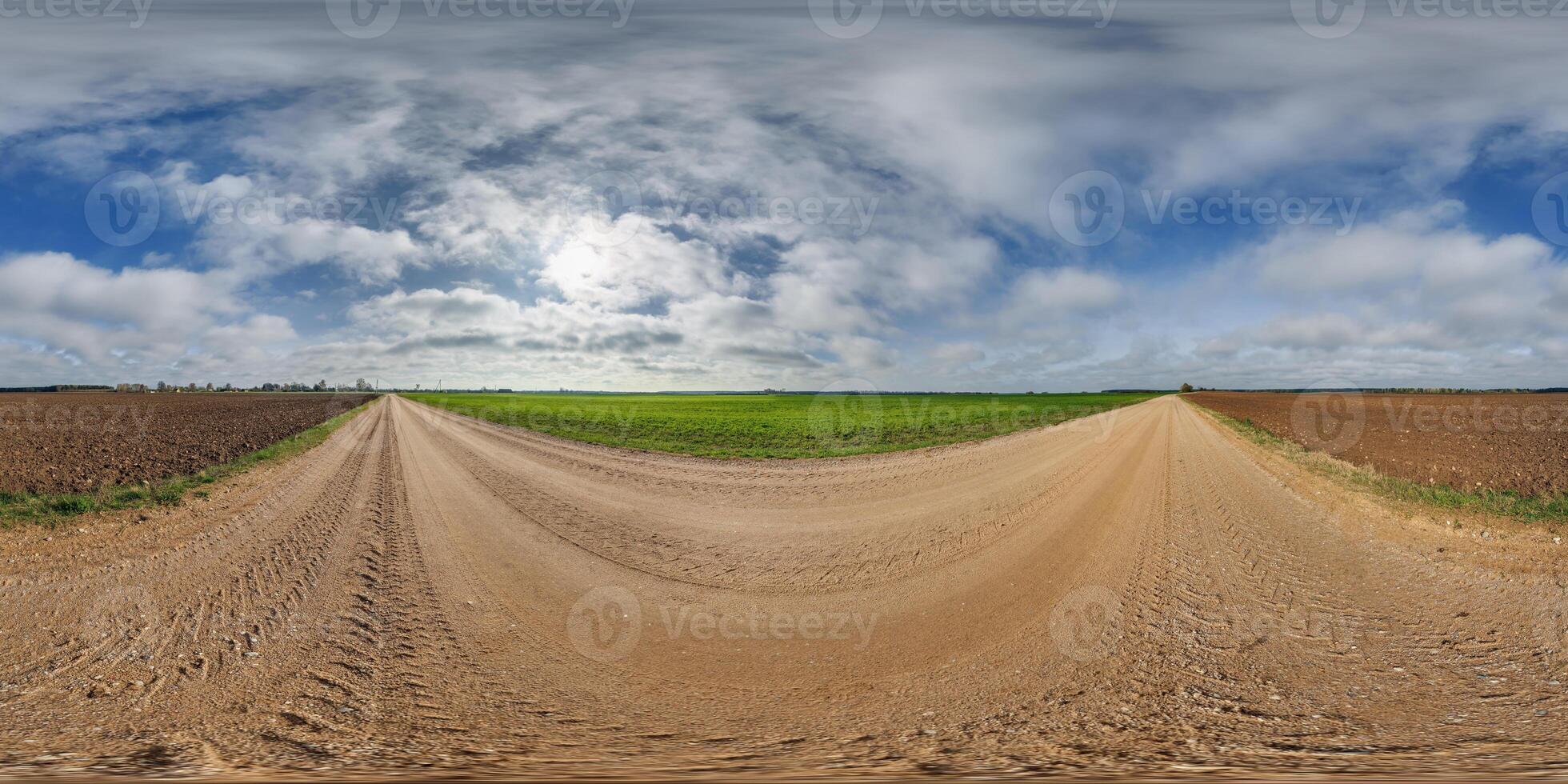 blue sky hdri 360 panorama with awesome clouds on gravel road among fields in spring day in equirectangular full seamless spherical projection, for VR AR content or skydome replacement photo