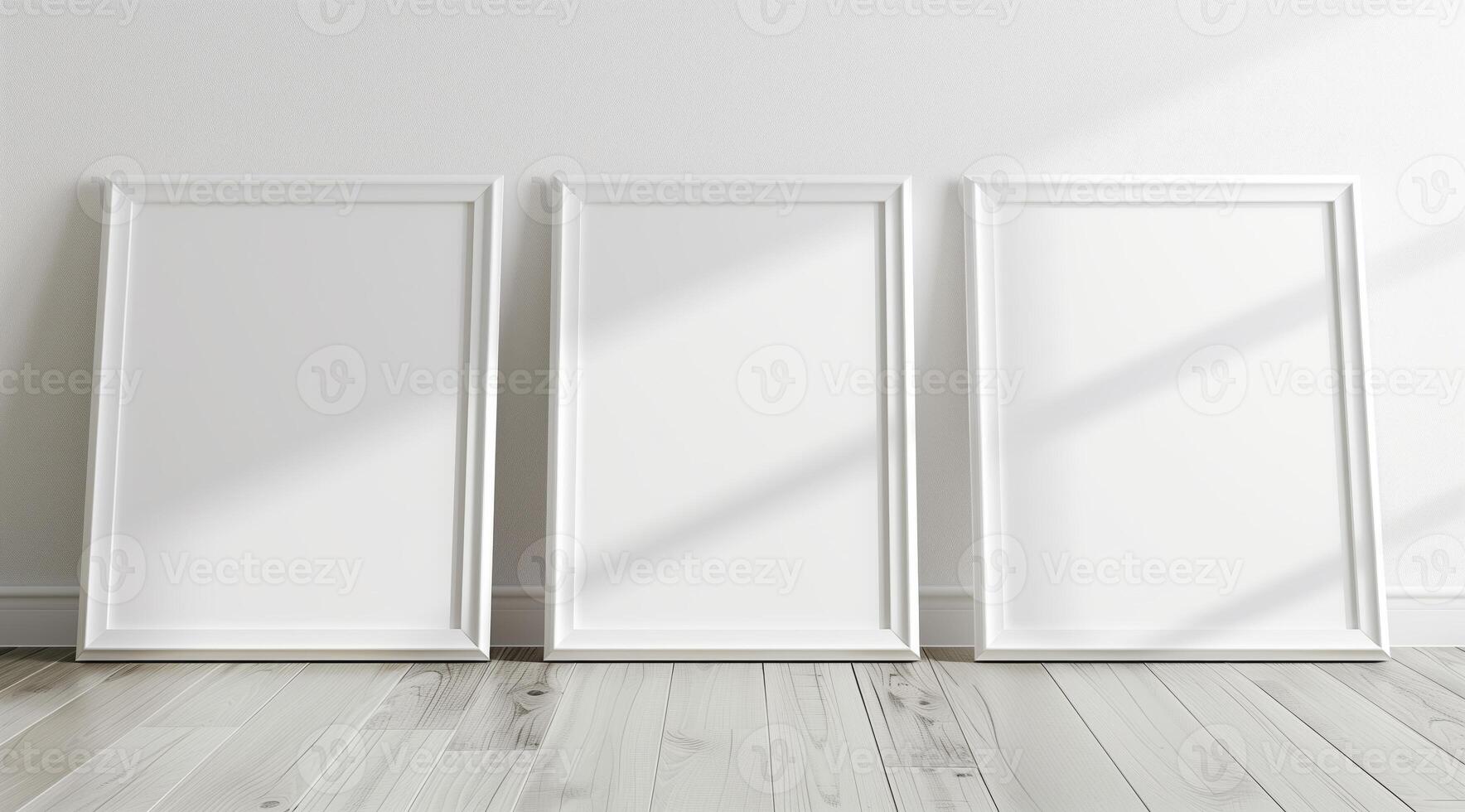 Front view of three white minimalistic picture frames on a light background. photo