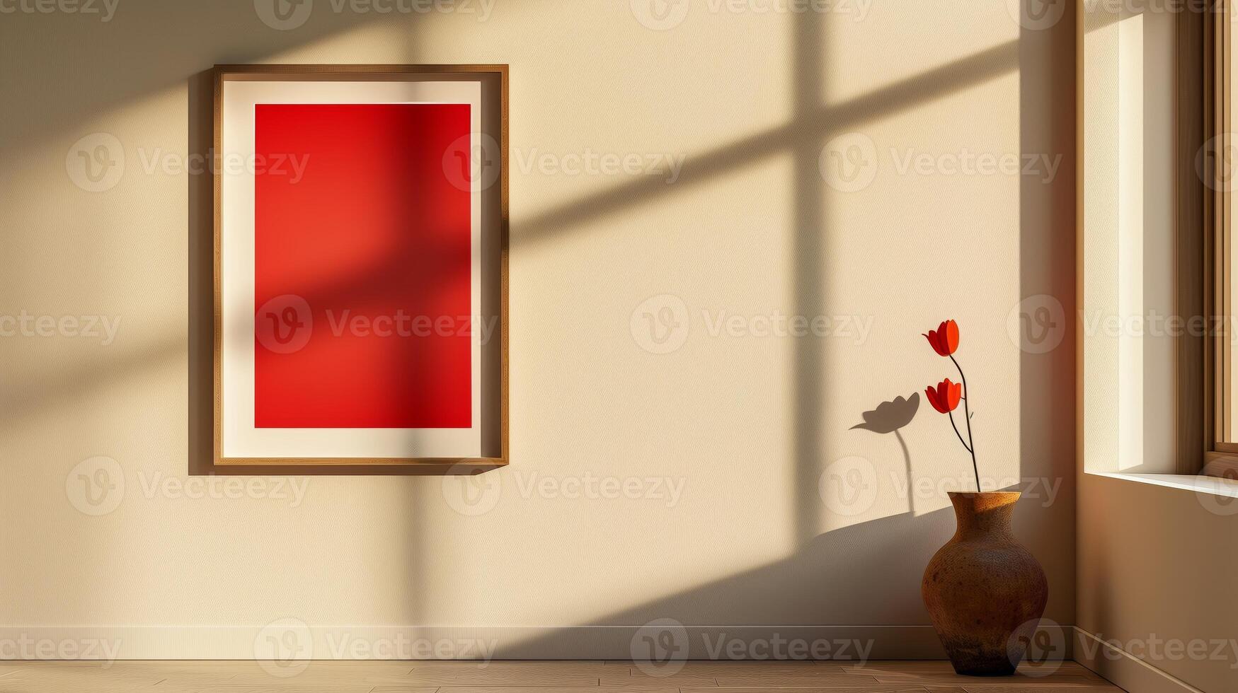 A simple wooden frame with a vibrant red poster hanging on the wall. photo