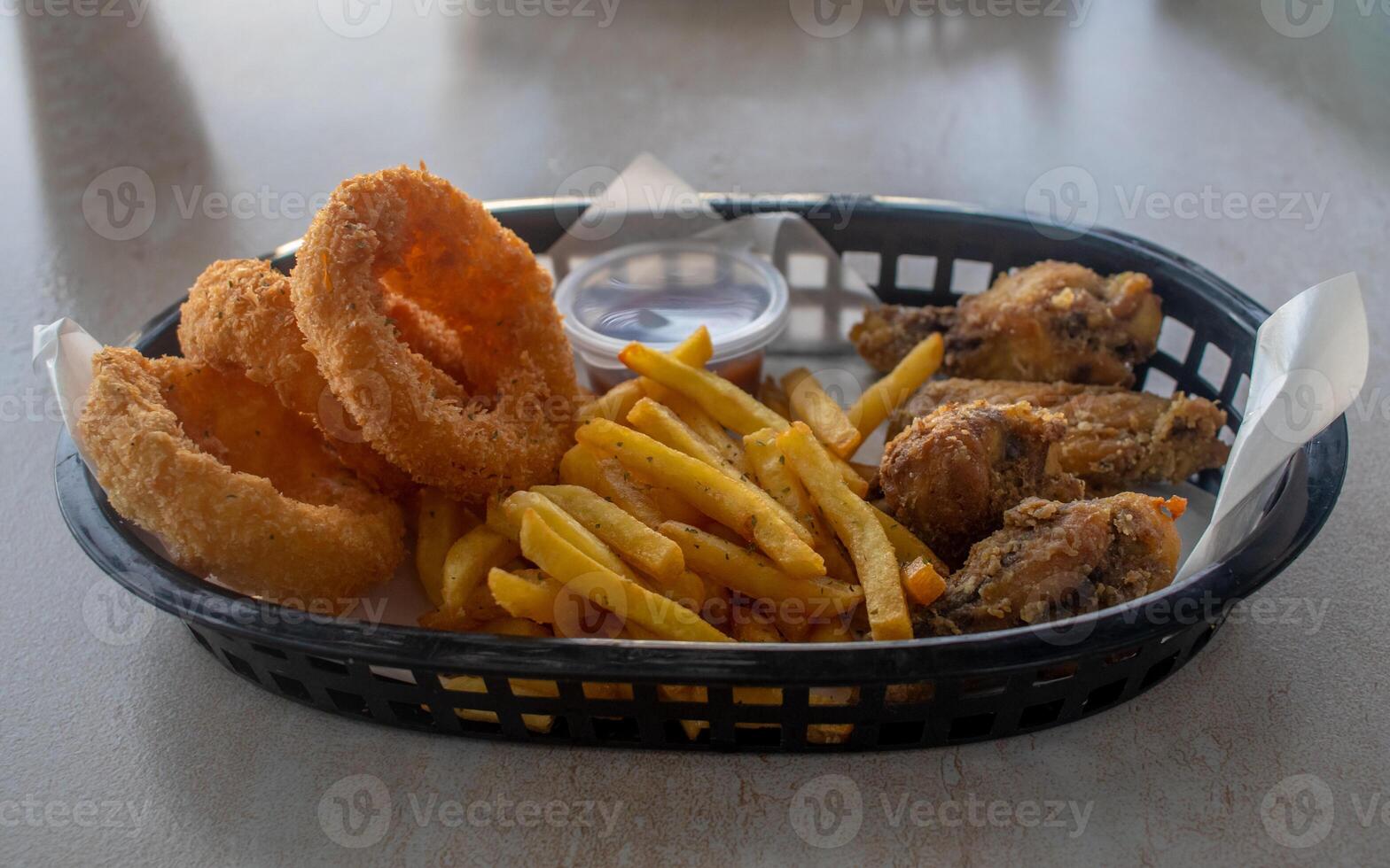 chicken and fries on a plate photo