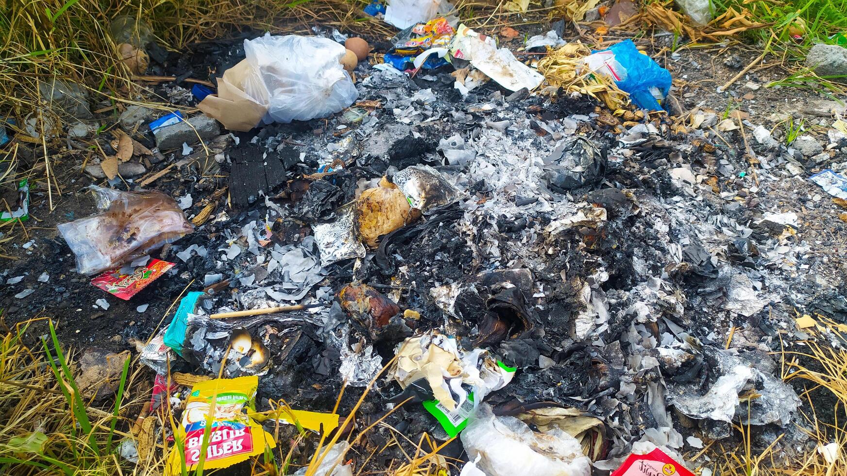 a pile of garbage and trash on the ground photo
