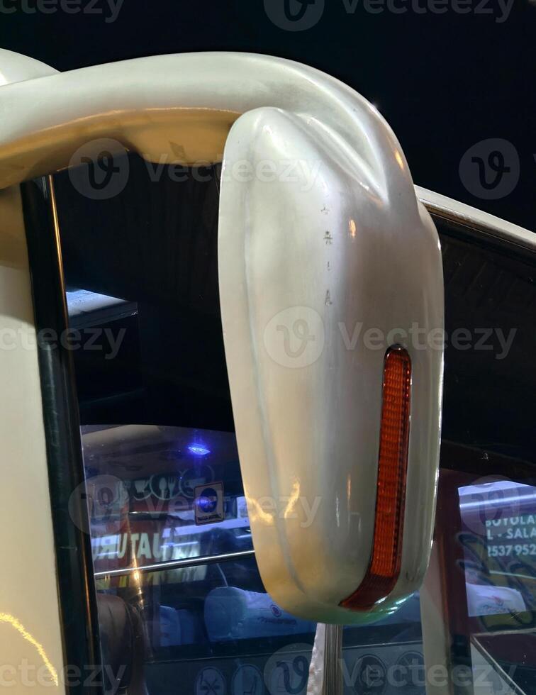 rear-view mirror in the bus. body part of transportation. photo
