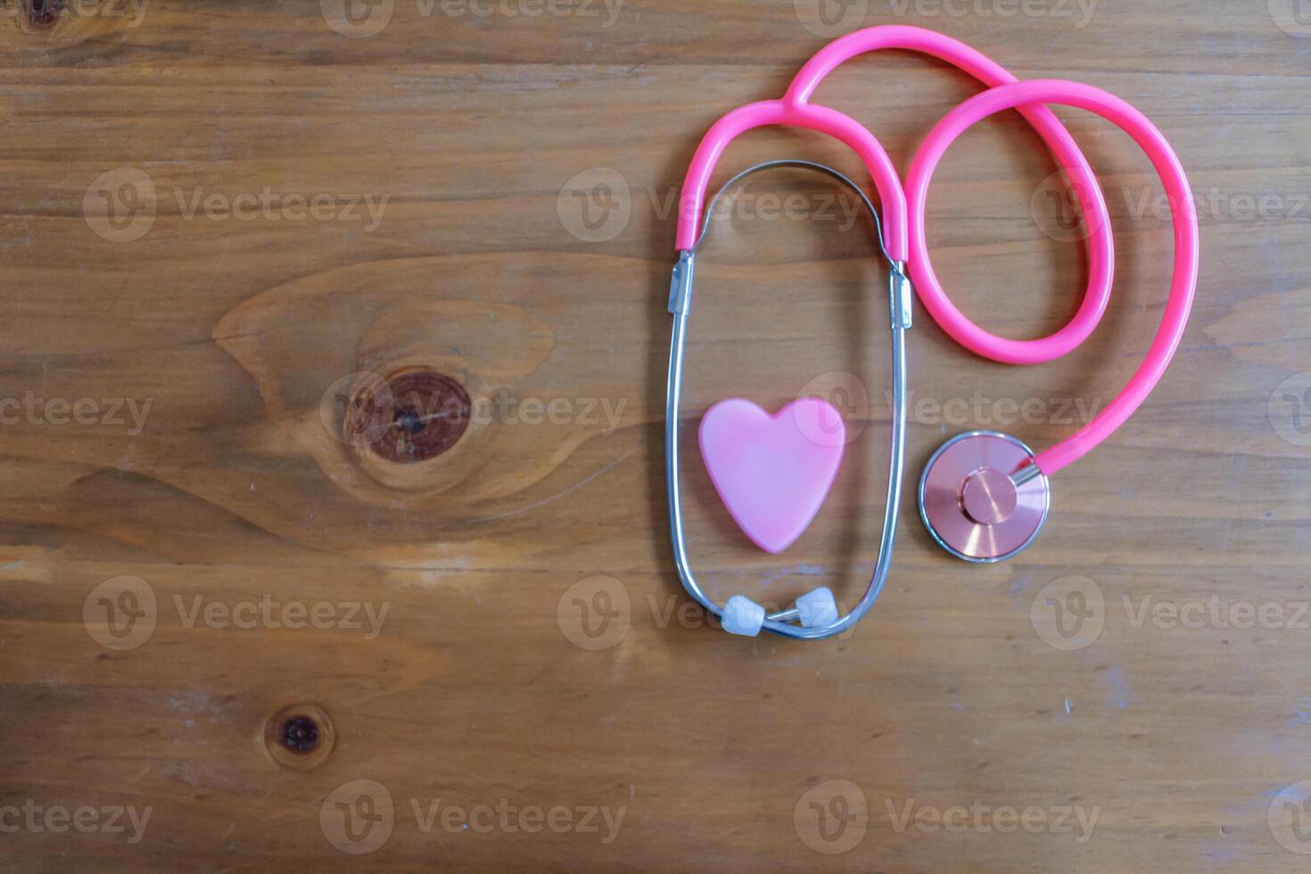 Doctors use stethoscope to listen patient heartbeat to find faults in heart disease. Doctors use stethoscope to listen patient heart rate to gather information diagnose disease and provide treatment. photo