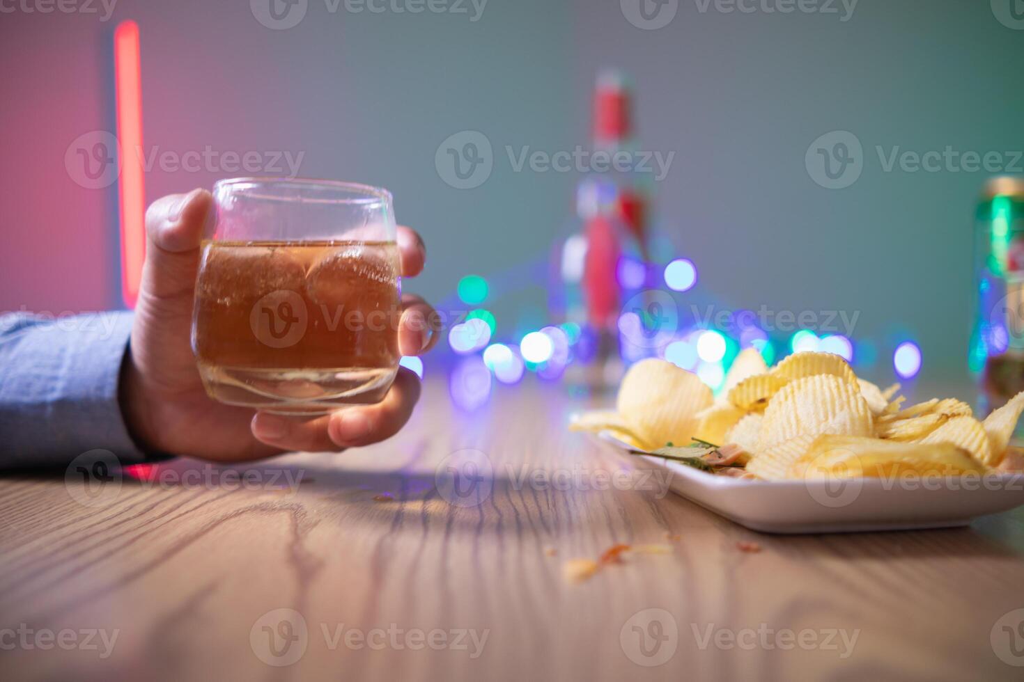 businessman sits alone in his office drinking brandy after discussing and agreeing with investors to do business in meeting until reaching satisfactory conclusion. concept of relaxing with brandy photo