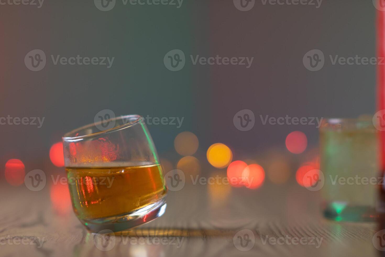 glass of alcohol is left on table after drinking with friends in office after work so that alcohol helps relax mind drinking alcohol in moderation and campaigning against drunk driving. photo