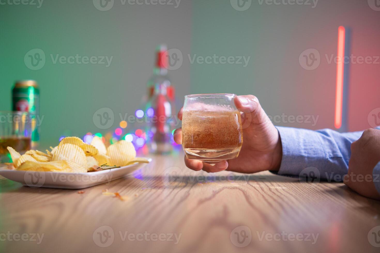 businessman sits alone in his office drinking brandy after discussing and agreeing with investors to do business in meeting until reaching satisfactory conclusion. concept of relaxing with brandy photo