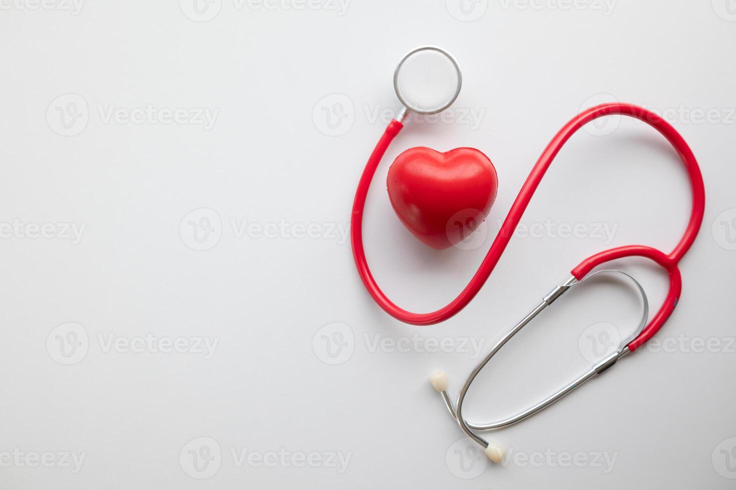 Doctors use stethoscope to listen patient heartbeat to find faults in heart disease. Doctors use stethoscope to listen patient heart rate to gather information diagnose disease and provide treatment. photo