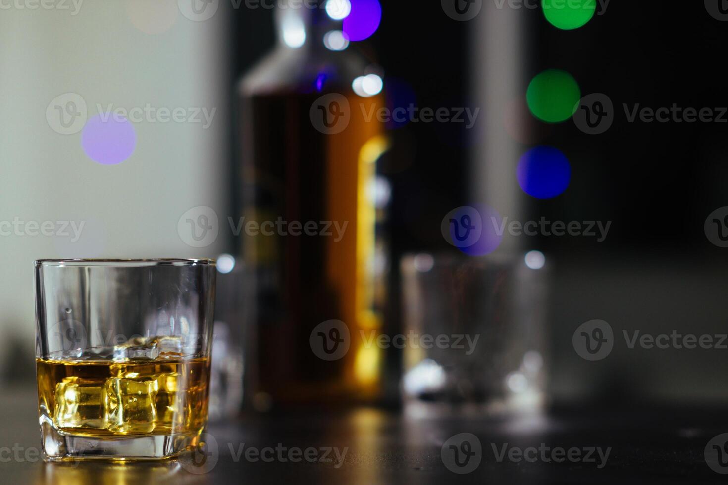 glass of alcohol is left on table after drinking with friends in office after work so that alcohol helps relax mind drinking alcohol in moderation and campaigning against drunk driving. photo