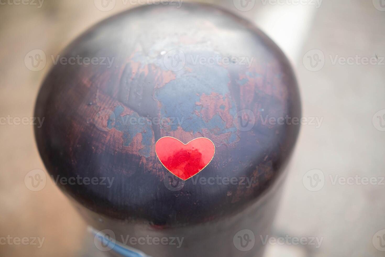Red heart shaped stickers were placed on metal poles along roadside and there was copy space for adding love messages. heart shaped symbol background says I love you, and heart shape of friendship. photo