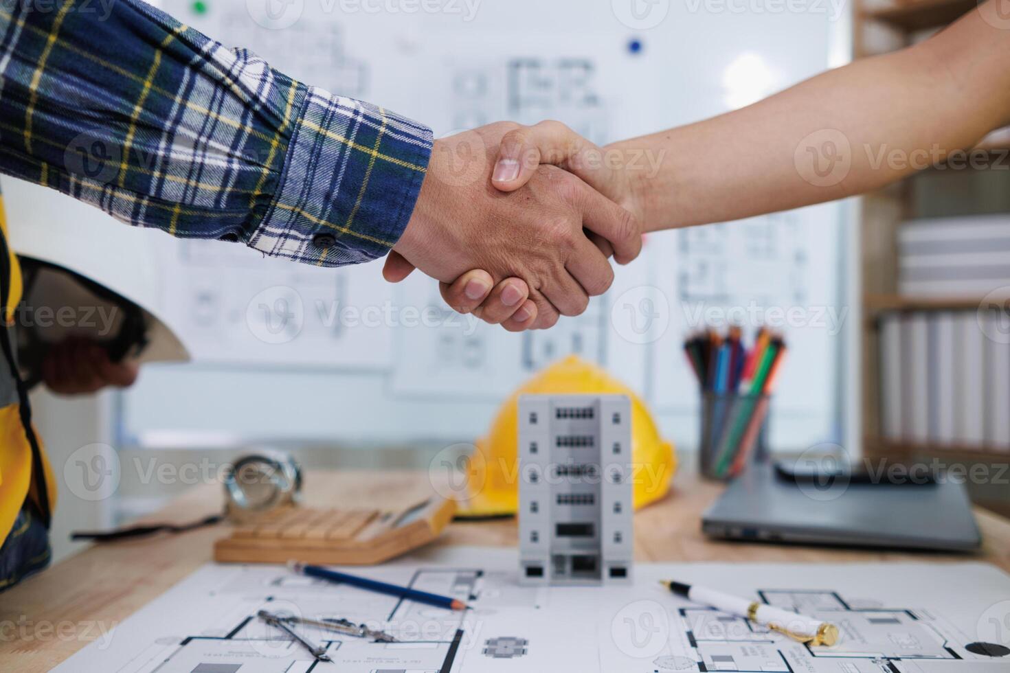 Businessmen and investors join hands after meeting and successfully agreeing on contract invest in real estate. Symbolic concept of touching hands touching hands together show cooperation and promise. photo