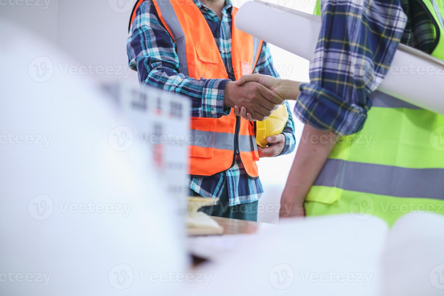 group of businessmen and investors join hands to symbolize cooperation in investing in real estate business together. concept of touching hands touching hands together to show cooperation and promise. photo