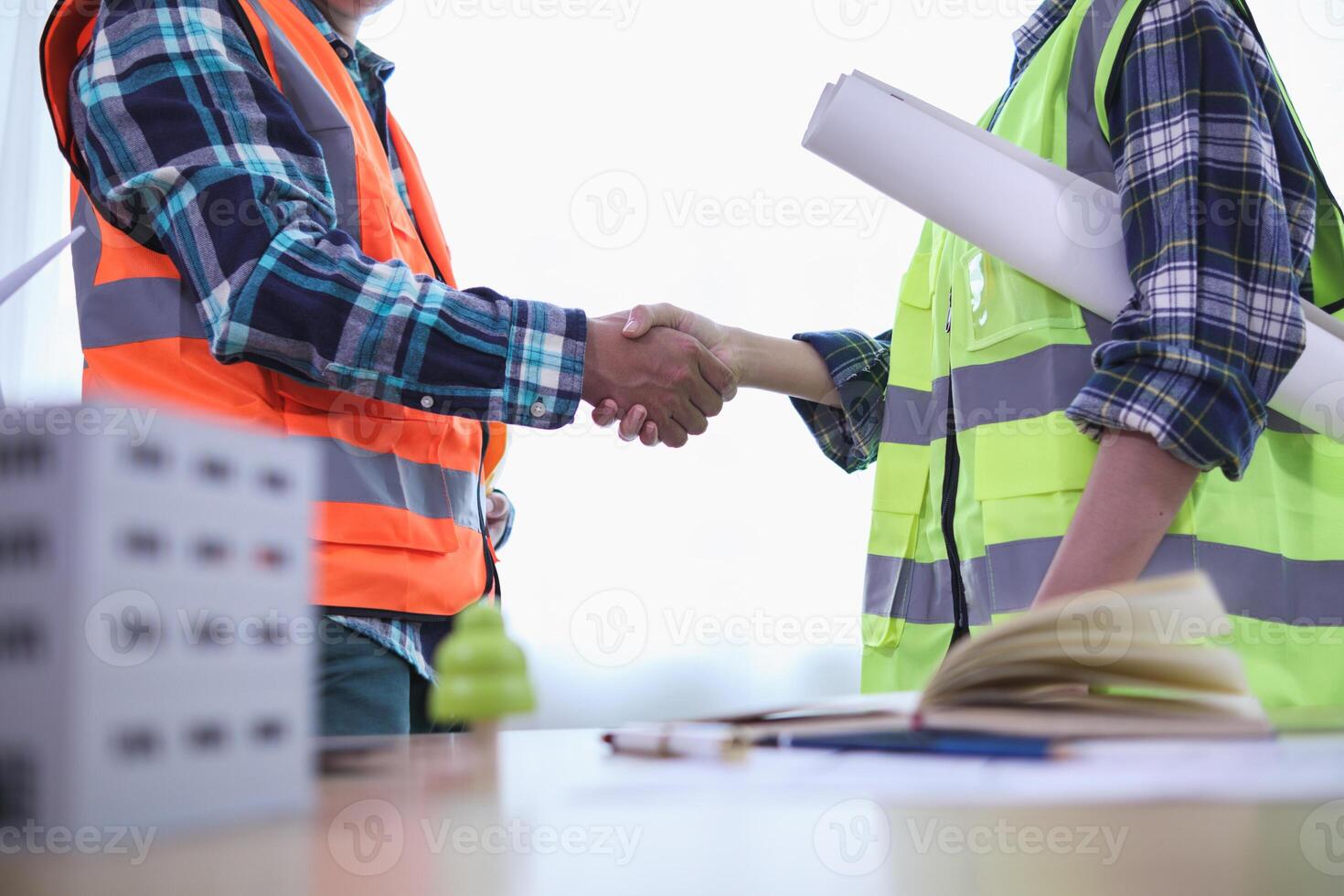 Businessmen and investors join hands after meeting and successfully agreeing on contract invest in real estate. Symbolic concept of touching hands touching hands together show cooperation and promise. photo