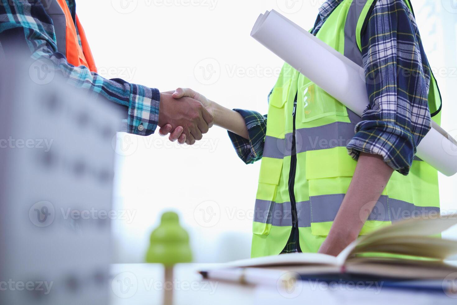 Businessmen and investors join hands after meeting and successfully agreeing on contract invest in real estate. Symbolic concept of touching hands touching hands together show cooperation and promise. photo