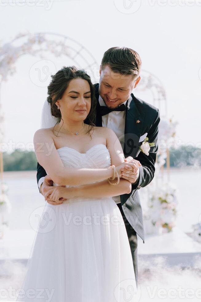 the first dance of the bride and groom inside a restaurant photo
