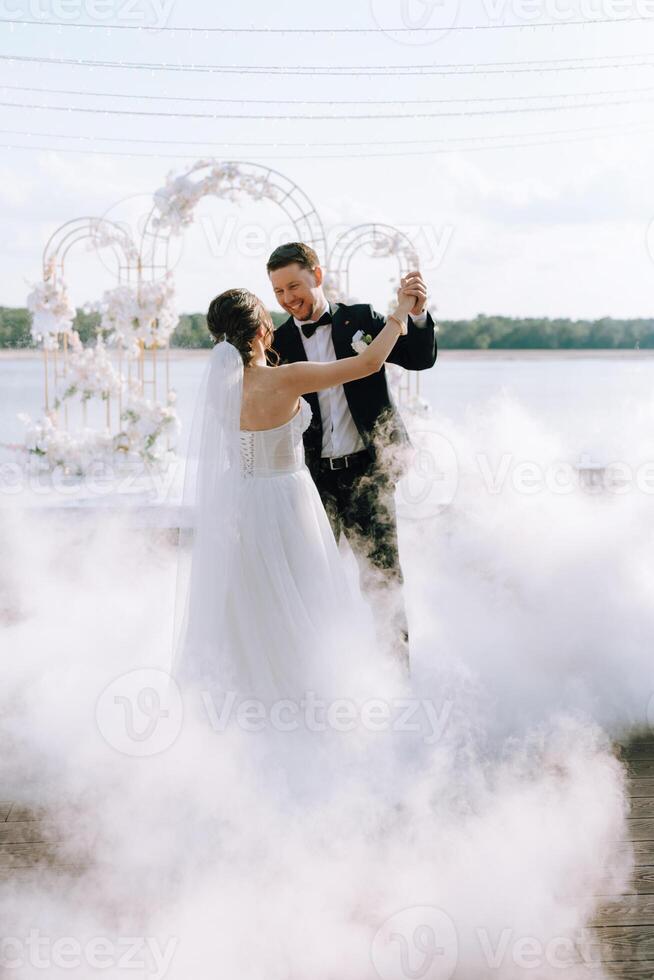 the first dance of the bride and groom inside a restaurant photo