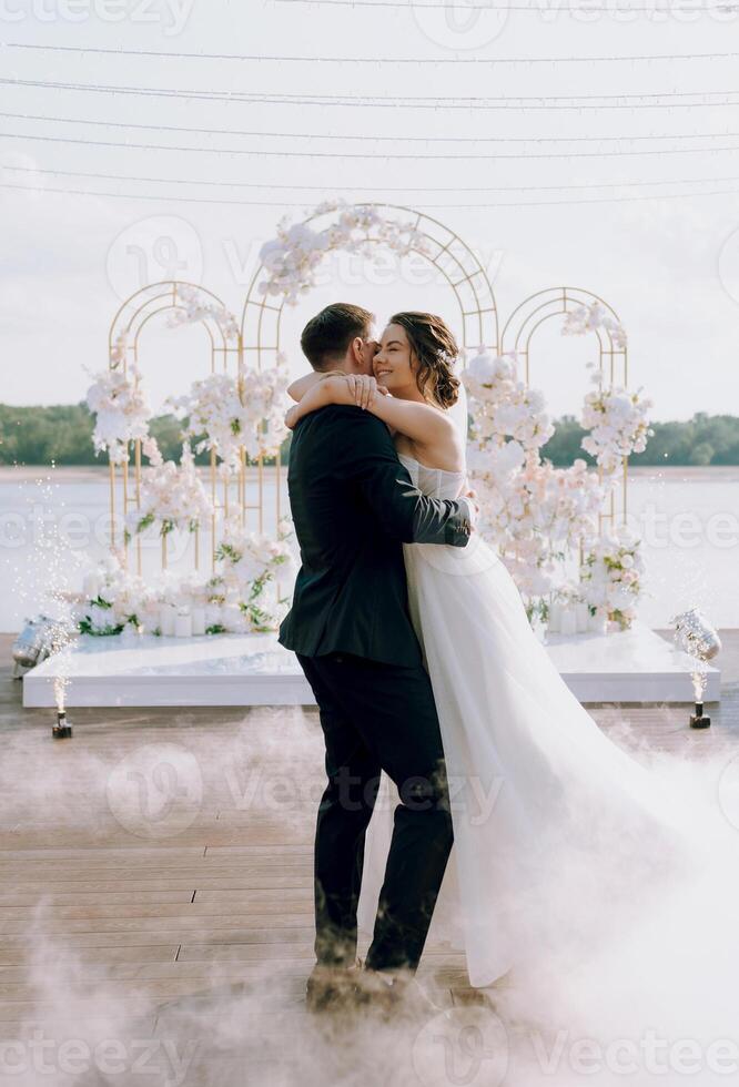 the first dance of the bride and groom inside a restaurant photo