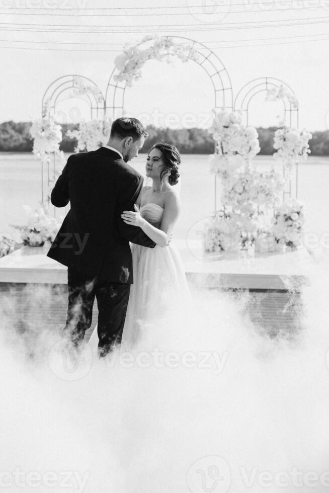 the first dance of the bride and groom inside a restaurant photo