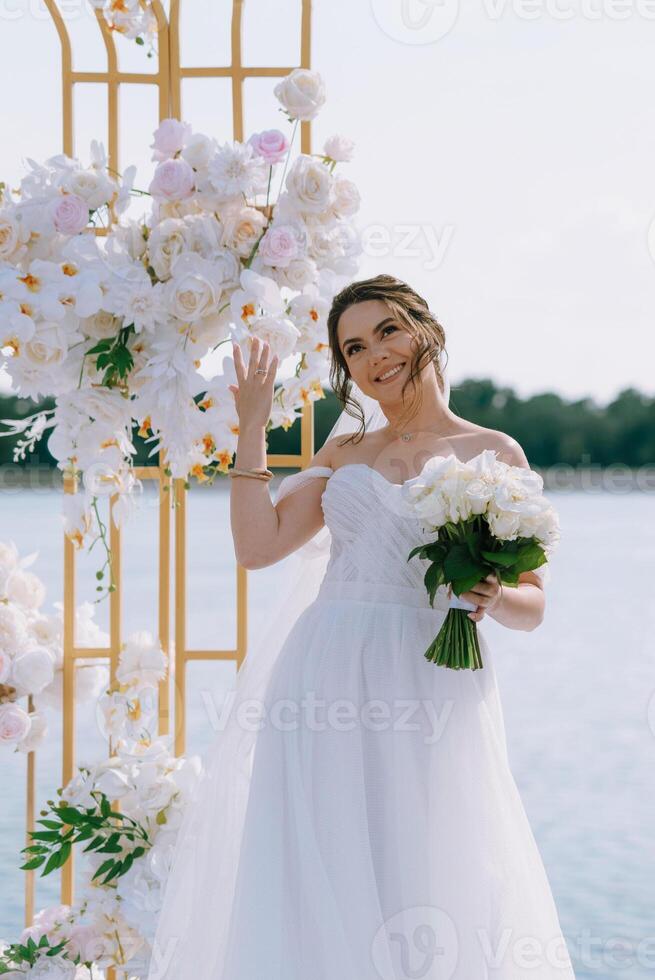 wedding ceremony of the newlyweds on the pier photo
